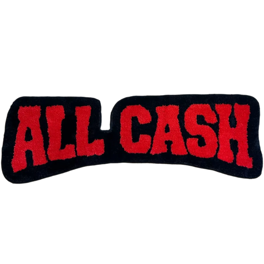 Tufted rug with "All Cash" text in bold letters, handmade plush texture.