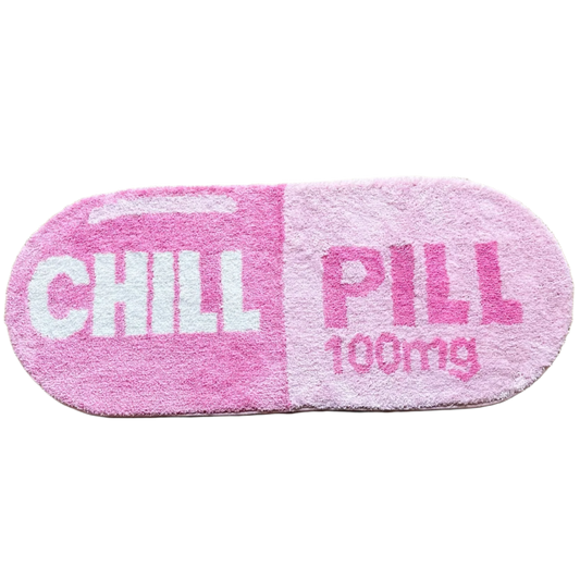Handmade rug shaped like a pink and white capsule pill.