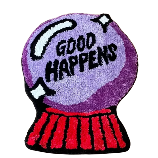 Crystal ball rug with "Good Happens" text and mystical styling.