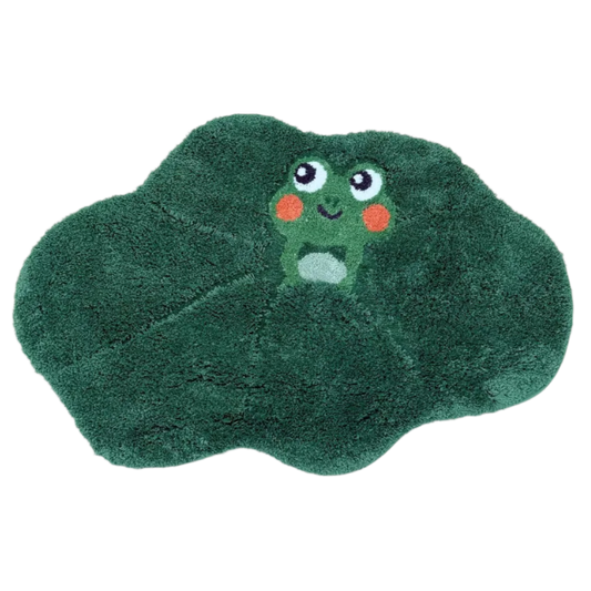 Cartoon frog with rosy cheeks sitting on a green lily pad.