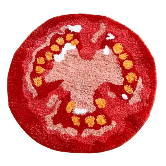 Tufted tomato-shaped rug in deep red with inner detail.