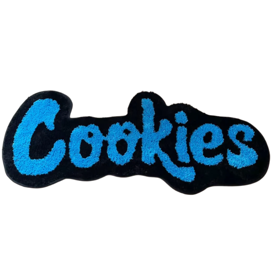 "Cookies" text tufted rug in Cookie Monster blue with playful thick font.