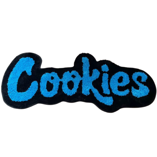 "Cookies" text tufted rug in Cookie Monster blue with playful thick font.