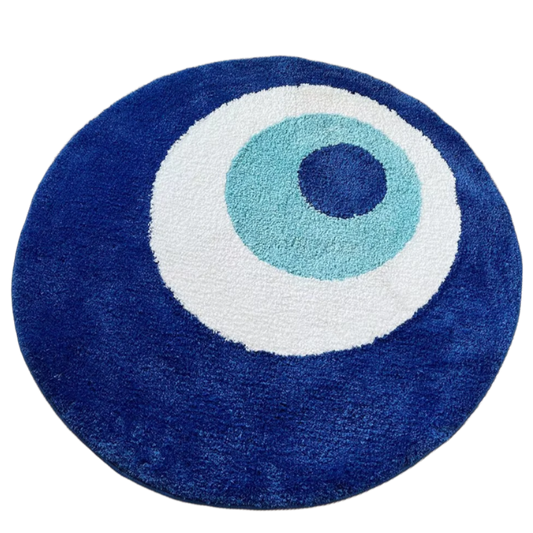 Blue and white tufted rug shaped like an evil eye symbol for protection.
