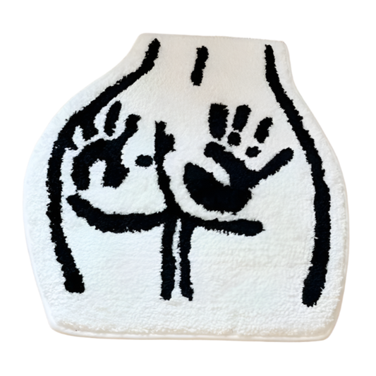 Cartoon butt on tufted rug with two handprints across the cheeks.