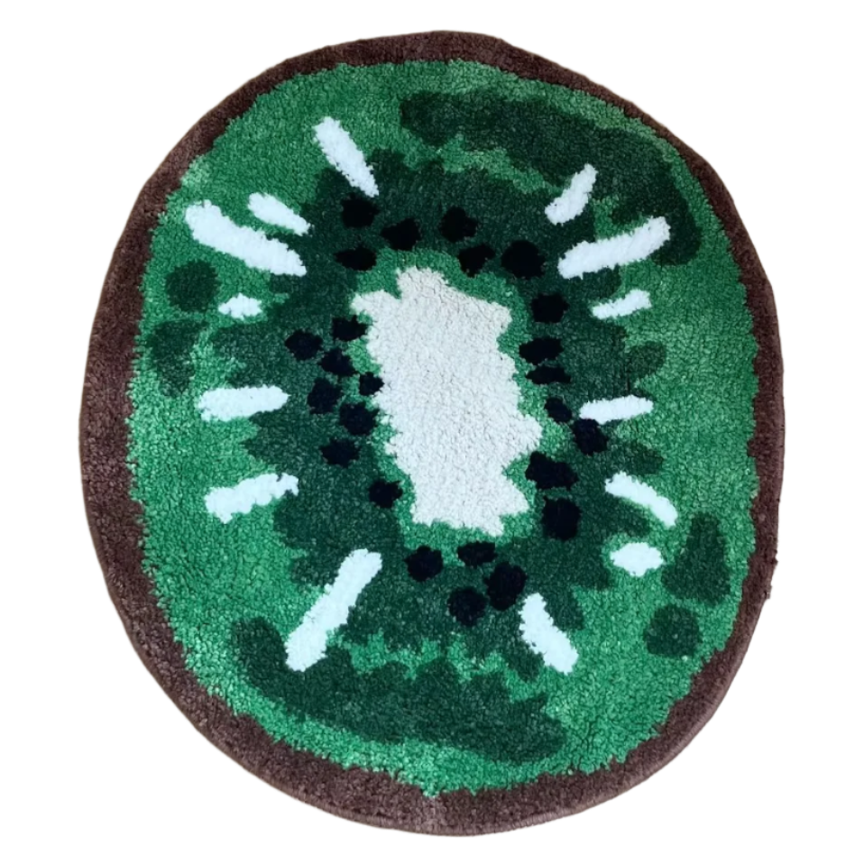 Handmade rug shaped like a sliced-open kiwi with green interior and seeds.