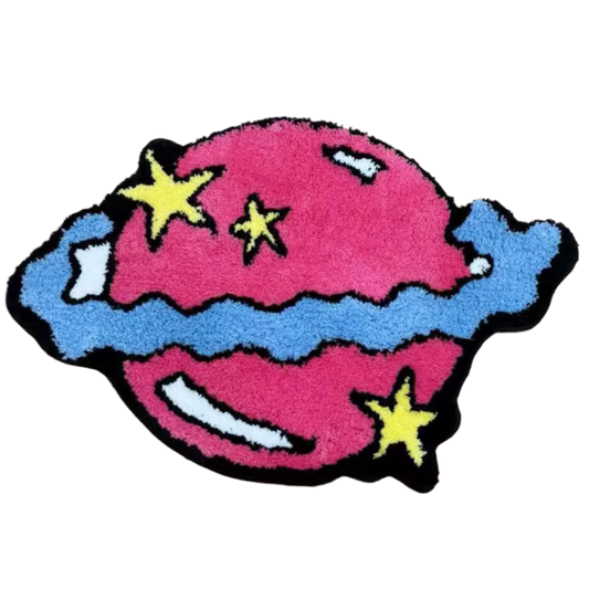 Soft pink planet rug with rings, cosmic pastel-themed design.